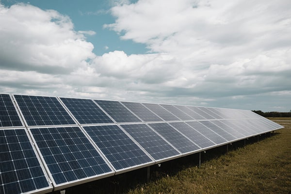 Cloudy sky over solar panels