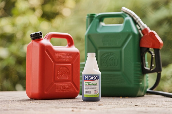 Fuel stabilizer bottle next to a gas can